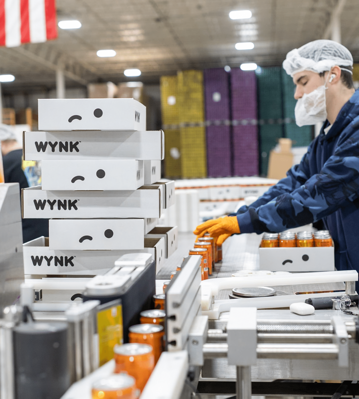 WYNK Tangerine 5mgTHC Seltzer being packaged in Wherehouse